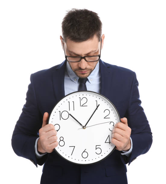 istock Businessman holding clock on white background. Time management 1322466552