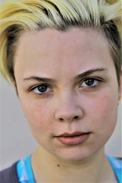 istock A close-up of a young woman with a serious expression 1322469692