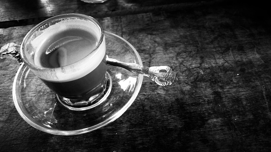enjoying a glass of espresso coffee mixed with milk, Aceh Timur, Aceh