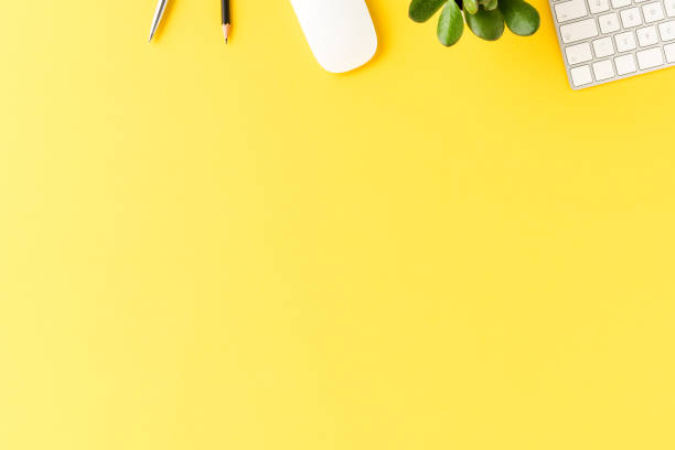 istock Overhead shot of business accessories on yellow background with copyspace. Office desktop 1322471467