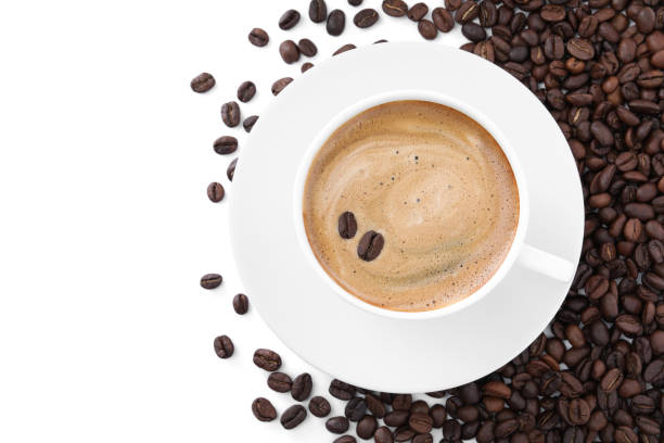 istock Cup with aromatic coffee and pile of beans on white background, top view 1322472852