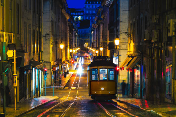 vintage carrier on tram line 28 in lisbon, portugal at night