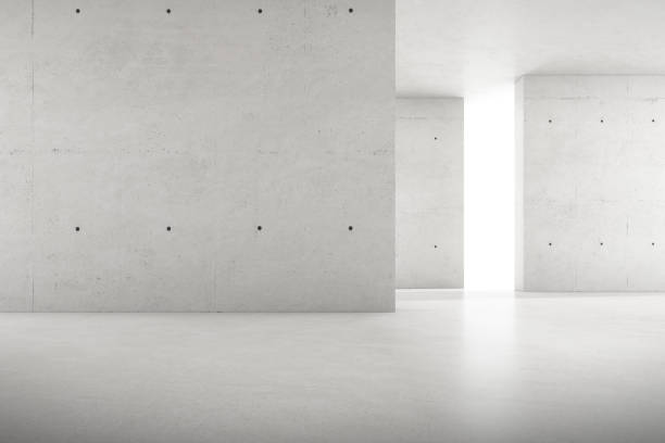istock Abstract 3d rendering of empty concrete room with light and shadow on the wall. 1322473281