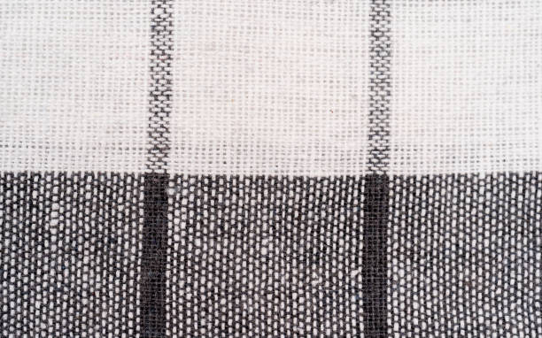 istock Closeup of a red and white checkered napkin or tablecloth texture isolated on white background 1322474049