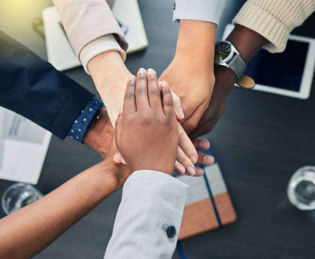 istock Shot of business colleagues with their hands stacked at work 1322474610
