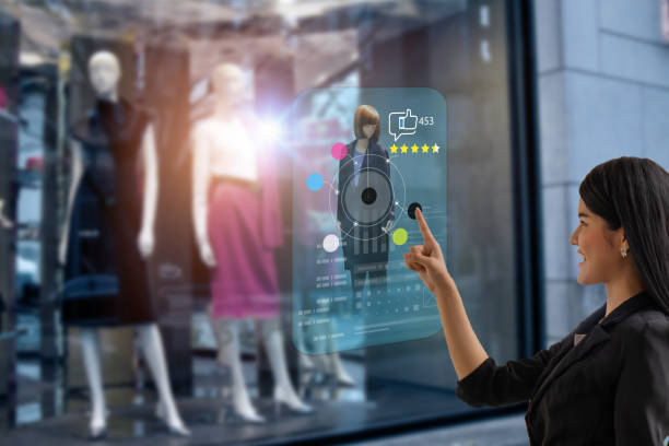 istock smart retail, shopping online technology concept, woman try to use smart display with virtual or augmented reality in the shop or retail to choose select ,buy cloths and give a rating of products 1322481345