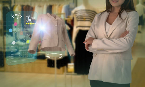 istock Smart retail, shopping online technology concept, woman try to use smart display with virtual or augmented reality in the shop or retail to choose select ,buy cloths and give a rating of products 1322481350