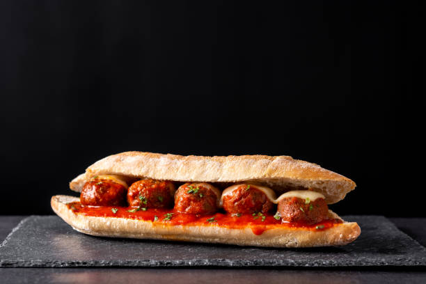 Meatball sub sandwich Meatball sub sandwich on black slate background marinara stock pictures, royalty-free photos & images