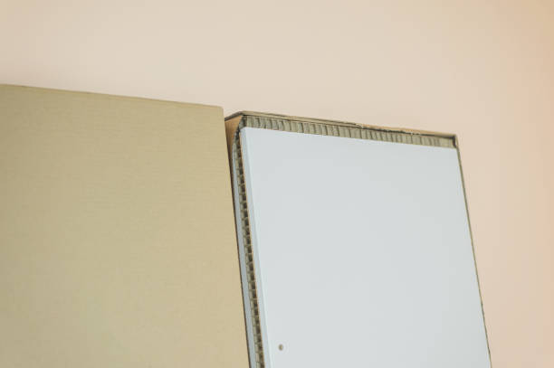 istock open cardboard box with white furniture boards 1322483964