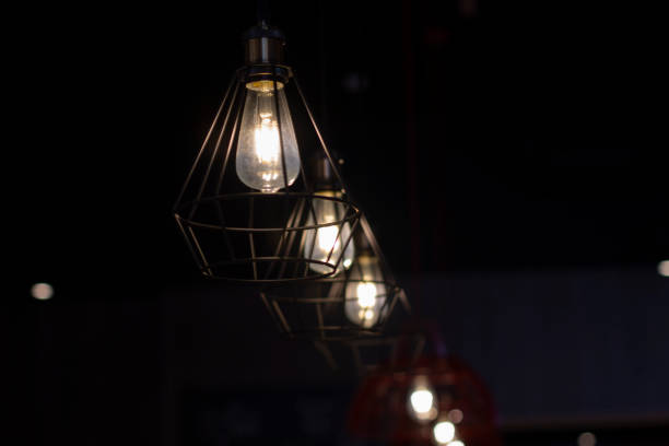 istock Stylish lamps hang in the dark. 1322485344