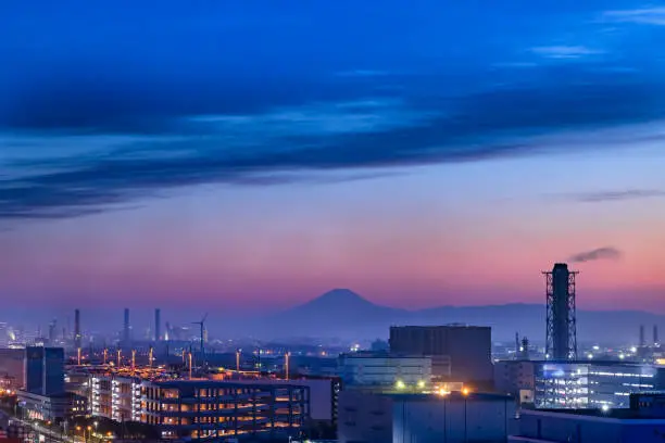 Kawasaki industrial area at dusk and Mt. Fuji seen in the distance