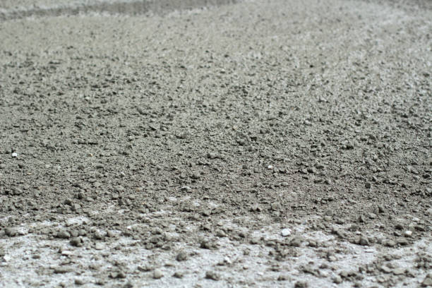 istock Liquid cement at a construction site. Cement spilled onto the road. 1322485377