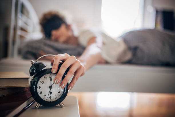 istock Woman waking up early 1322489983