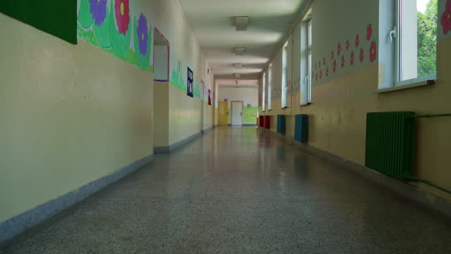 The empty school hall, with a colorful walls, with flowers drawing