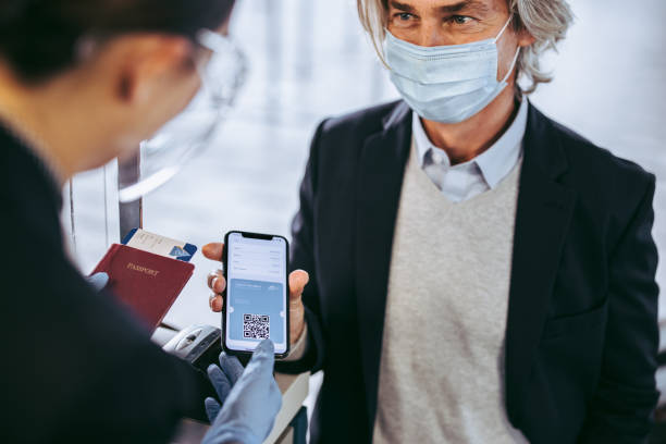 istock Businessman check in at airport with negative coronavirus test result 1322491364