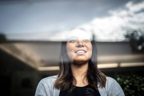 istock Young woman contemplating at home 1322493491
