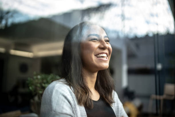istock Young woman contemplating at home 1322493506