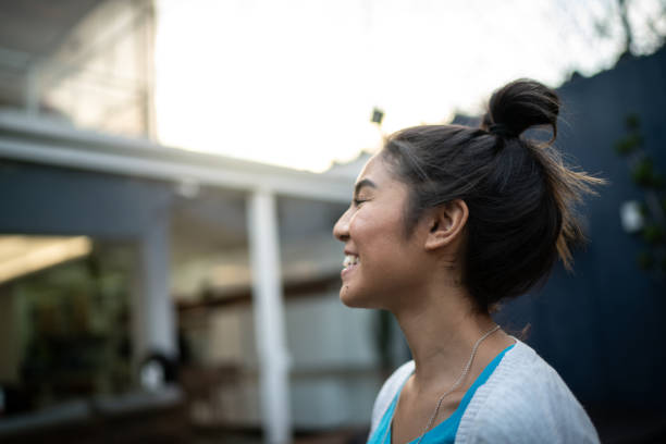 istock Happy woman inhaling at home 1322493530