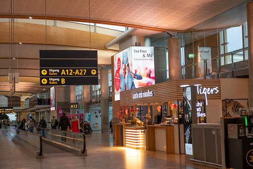 Gardermoen, Norway - February 17, 2020. Passengers walking in the terminal at Oslo Gardermoen Airport in Norway.