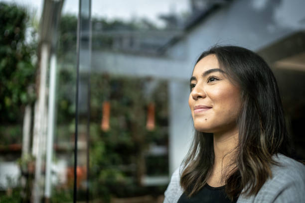 istock Young woman contemplating at home 1322493554