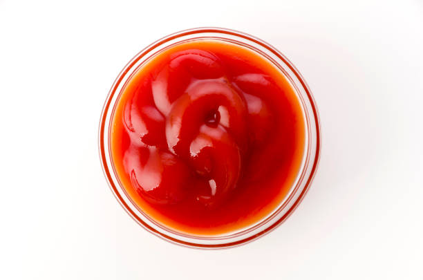 istock tomato ketchup in a small glass bowl on a white background 1322494130