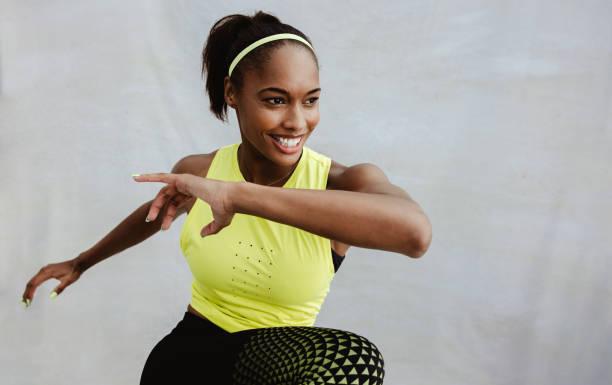 istock Confident sportswoman doing stretching exercises 1322494307
