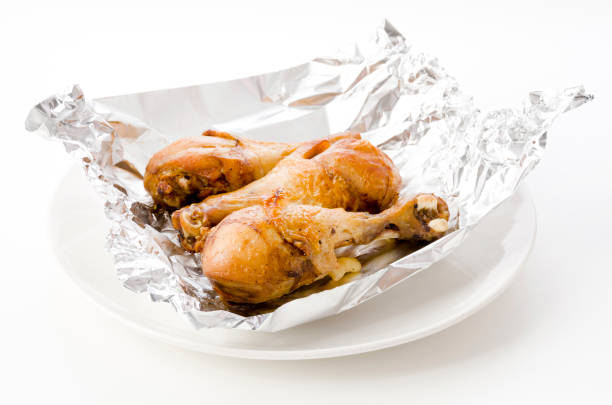 istock Grill Chicken Legs on Aluminum Foil 1322494364