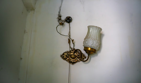 Old electric light on the wall of a Chinese house