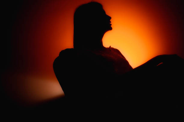 istock Unknown female person silhouette in colors, dancing, standing, seating. 1322497168