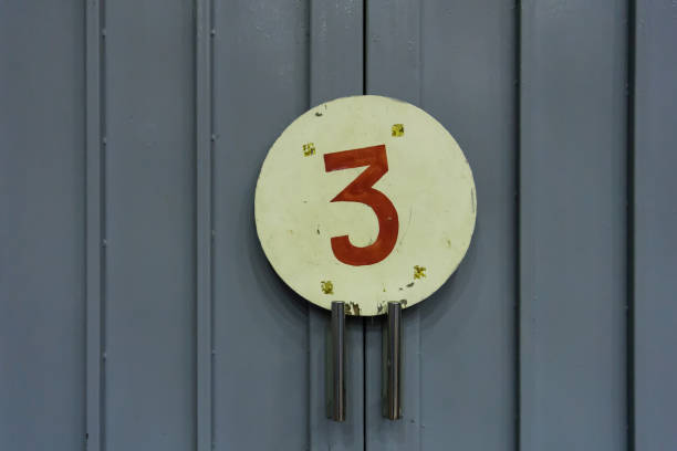 istock Number three on door in old gymnasium 1322498450