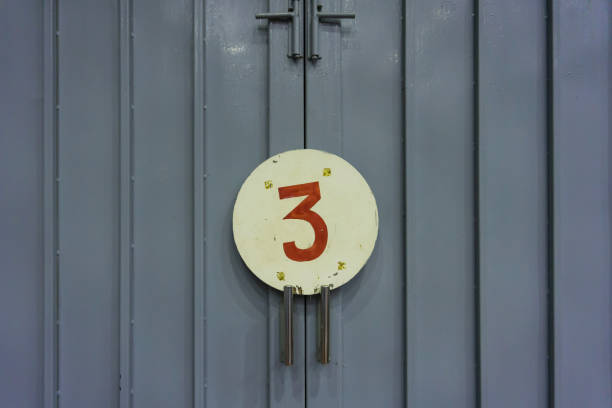 istock Number three on door in old gymnasium 1322498458