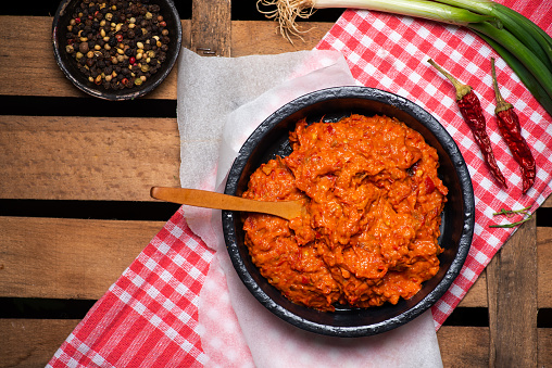 Ajvar paprika spread pepper based condiment made from red bell peppers. It also contains garlic, eggplant and chili peppers. Ajvar is used in the Balkans cuisine including Slovenian, Albanian, Bulgarian, Macedonian, Bosnian, Croatian, and Serbian cuisine.