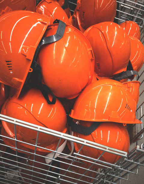 istock heap of construction hard hats (a mobile photo) 1322503601