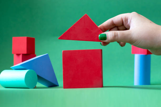 istock red house from children's soft constructor on a green background 1322505131