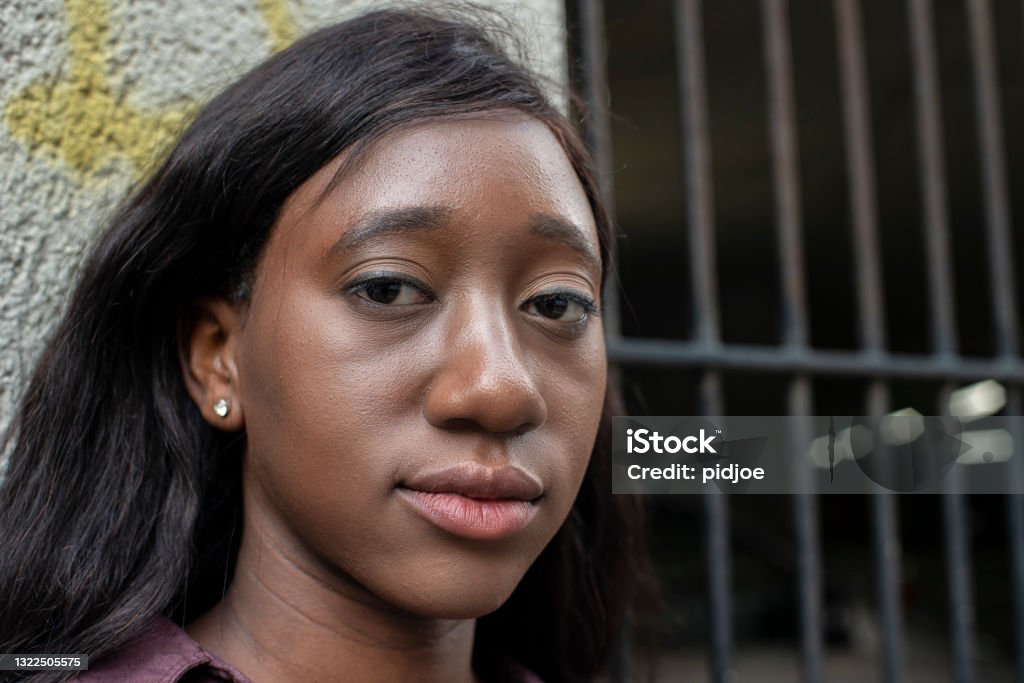 Portrait of a young woman of Indian decent , looking away. In shoreditch, London Portrait of a young woman of Indian decent , looking away. In Shoreditch, London Close-up Stock Photo