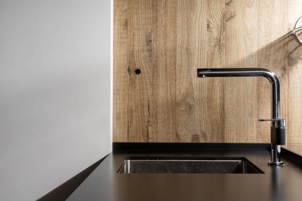 istock Black built in sink in new stylish kitchen 1322511730