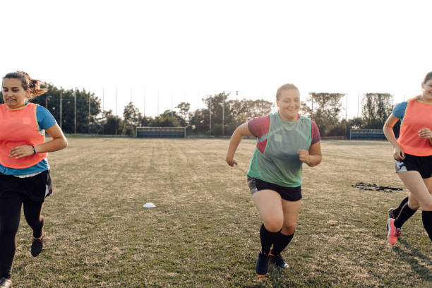 istock Female rugby team training on the field 1322512734