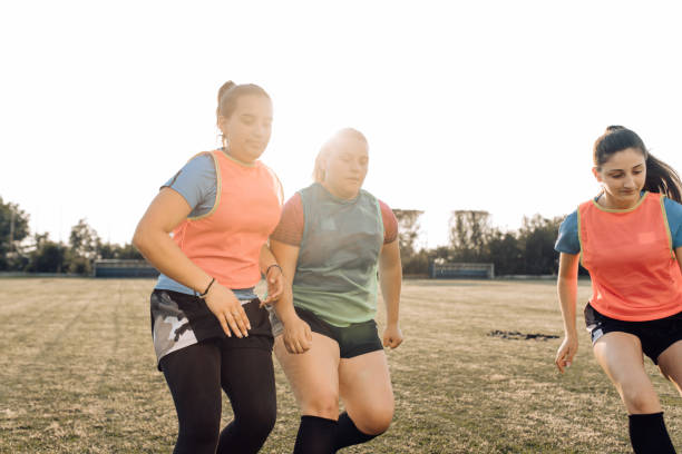 istock Girls rugby team training on the field 1322512741