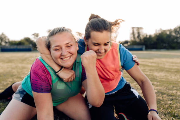 istock Two girls from a rugby team celebrating a victory 1322512767