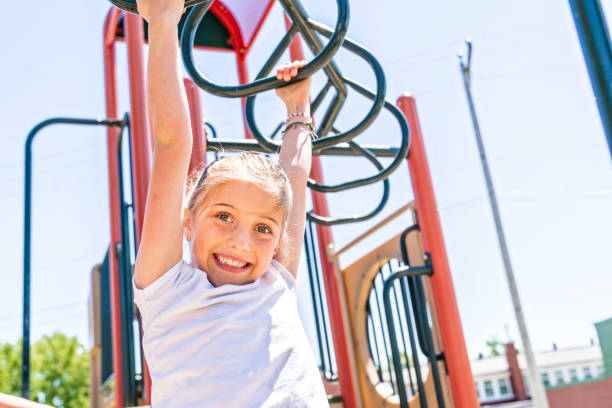 istock Active little girl having fun on playground on the summer time 1322512967