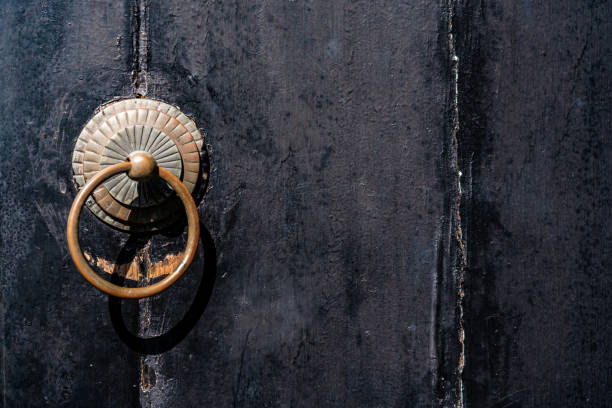 istock Ancient door knocker on a wood 1322513046