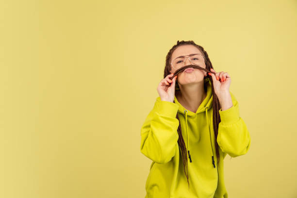 istock Caucasian young woman's portrait isolated over yellow studio background with copyspace 1322514499