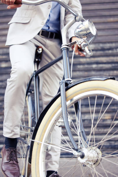istock Shot of an unrecognizable man riding a bicycle 1322516550