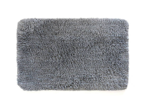 Clean bathroom doormat isolated on white. Aerial view of microfiber bath mat with gray hair. Thick absorbent and non-slip mat. Antibacterial shower mat. Complement of bathroom, kitchen. Clean bathroom doormat isolated on white. Aerial view of microfiber bath mat with gray hair. Thick absorbent and non-slip mat. Antibacterial shower mat. Complement of bathroom, kitchen. beach mat stock pictures, royalty-free photos & images