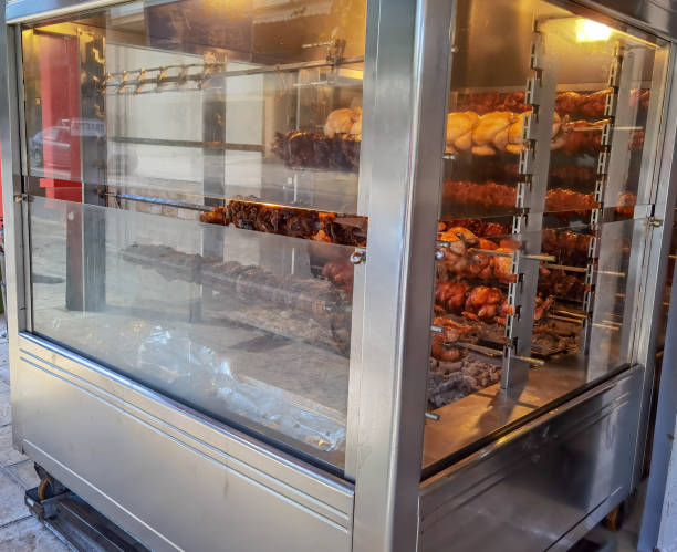 istock grilled spit chickens, mobile wagon grill on pedestrian street 1322518542