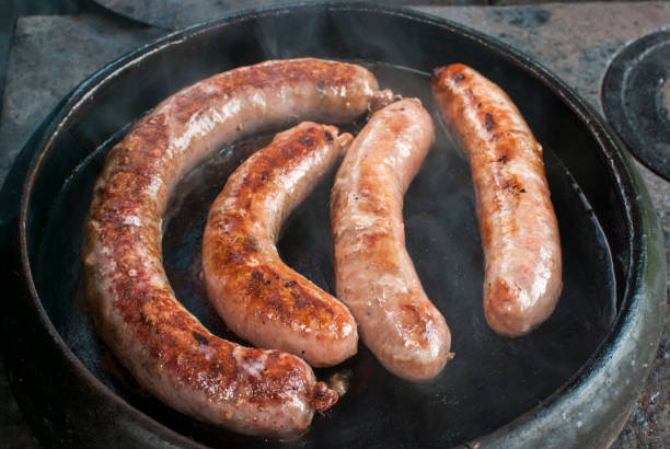 istock Roasted sausages in clay pot 1322520553