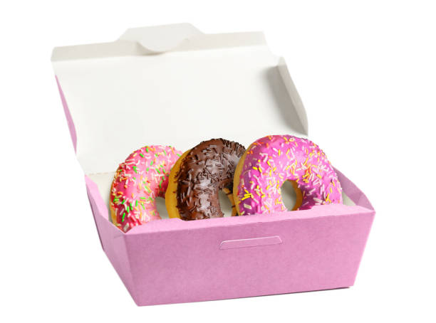 istock Glazed Doughnuts in paper box isolated on white background. 1322520782