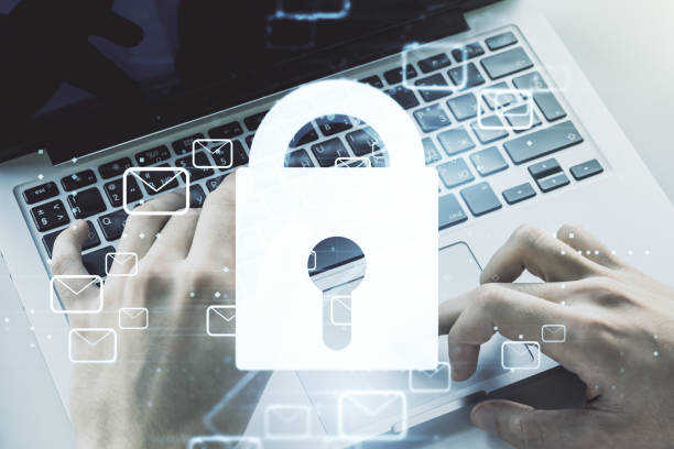 istock Creative concept with lock symbol and postal envelopes illustration and with hands typing on laptop on background. Protection and firewall concept. Multiexposure 1322520816