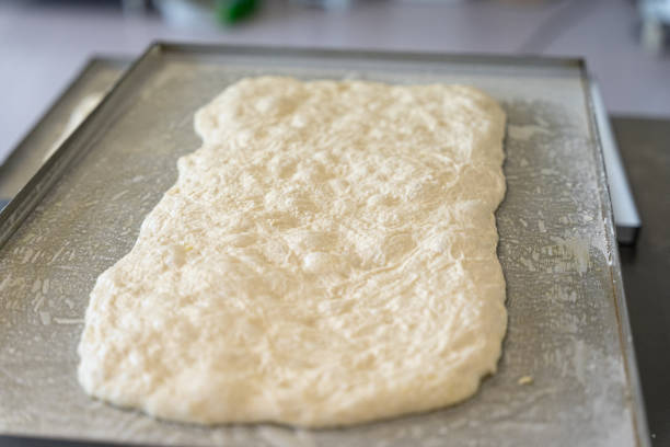 Pizza making pizza making baking sheet stock pictures, royalty-free photos & images