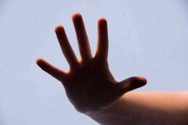 Human hand break out of paper.